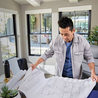 Architect looking at technical documents